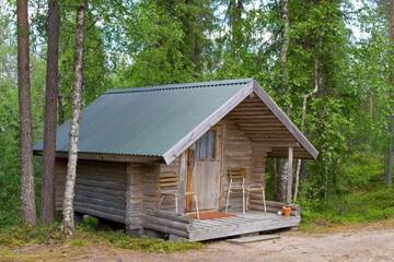 Фото номера Коттедж с общей ванной комнатой (для 2 взрослых) Кемпинги Kangasjoki Camping г. Суомуссалми 2