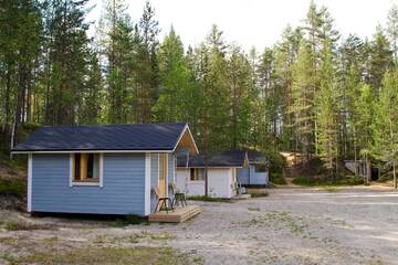 Фото номера Коттедж с общей ванной комнатой (4 взрослых) Кемпинги Kangasjoki Camping г. Суомуссалми 5