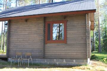 Фото номера Коттедж с сауной Кемпинги Kangasjoki Camping г. Суомуссалми 6